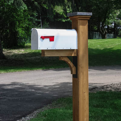 cedar mailbox post with granite post cap and white mailbox